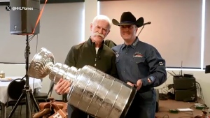 Lanny McDonald visited a Calgary Police Service fundraiser Friday night to surprise Const. Jose Cives, who saved McDonald's life when he had a near-fatal heart attack at Calgary Airport in early February.