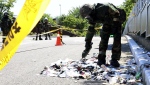 South Korean soldier wearing protective gears checks trash from a balloon likely sent by North Korea in Incheon, South Korea.(Im Sun-suk/Yonhap via AP)