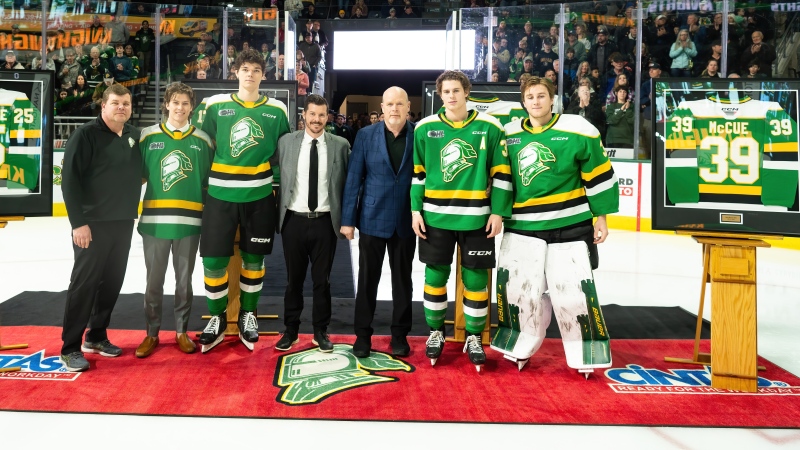 Over-age players Ethan MacKinnon (retired), Kaleb Lawrence, third, Max McCue, fifth and Michael Simpson, sixth, pose with London Knights staff. (Source: London Knights) 