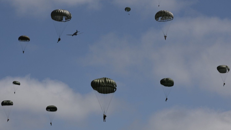 Parachute drop in Carentan-Les-Marais in Normandy, France on Sunday, June 02, 2024, ahead of D-Day 80th anniversary commemorations. (Jeremias Gonzalez/AP Photo)