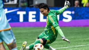 Vancouver Whitecaps goalkeeper Yohei Takaoka (1) makes a save against the Colorado Rapids during the first half of an MLS soccer match in Vancouver, on Saturday, June 1, 2024. THE CANADIAN PRESS/Ethan Cairns
