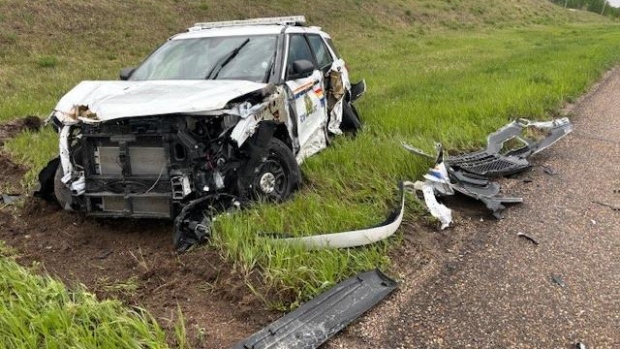 A police vehicle was heavily damaged after being rammed multiple times on Highway 40 near Neilburg. Sask. (Courtesy: Saskatchewan RCMP)