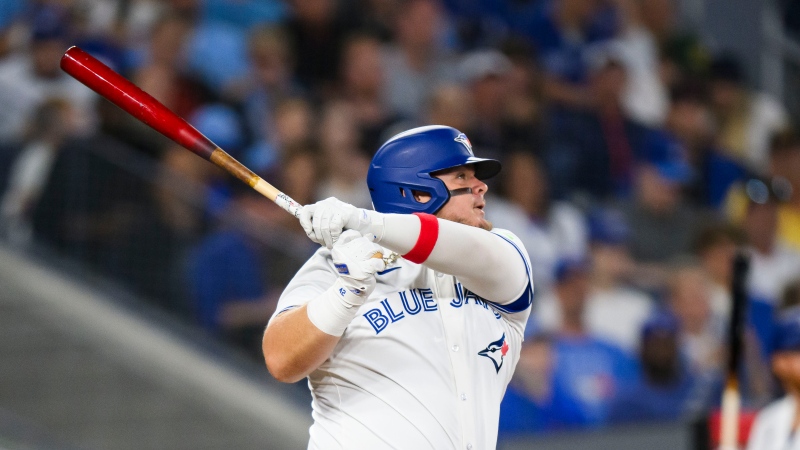 Toronto Blue Jays designated hitter Daniel Vogelbach (20) hits a two-run double during fifth inning MLB interleague action against the Pittsburgh Pirates, in Toronto, Sunday, June 2, 2024. THE CANADIAN PRESS/Christopher Katsarov