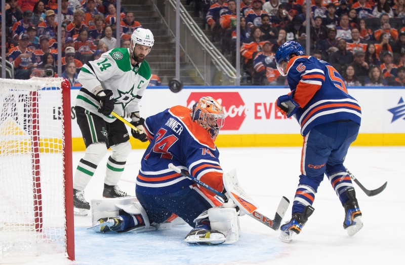 Dallas Stars captain Jamie Benn looks for the rebound from Edmonton Oilers goalie Stuart Skinner as defenceman Cody Ceci stands guard during third period action in Game 6 of the NHL Western Conference Final on June 2, 2024, in Edmonton. (Jason Franson/The Canadian Press)