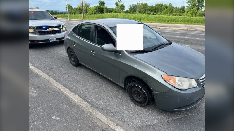 Ontario Provincial Police say a vehicle missing its front wheel drove past an OPP officer on Hwy. 417 over the weekend. (OPP/X)