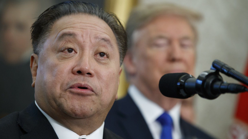 Broadcom CEO Hock Tan speaks as then-U.S. president Donald Trump listens during an event on Nov. 2, 2017 in Washington. (AP Photo/Evan Vucci, File)