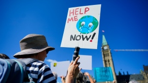 People participate in a climate protest on Parliament Hill in Ottawa on Friday, Sept. 15, 2023. THE CANADIAN PRESS/Sean Kilpatrick