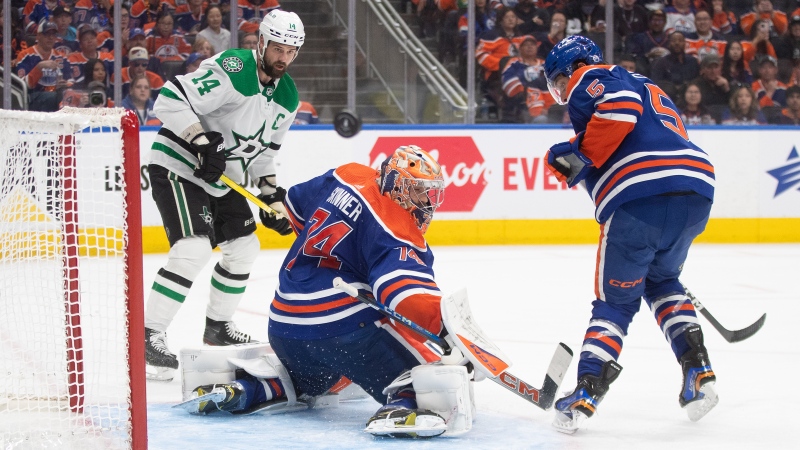 Dallas Stars' Jamie Benn (14) looks for the rebound from Edmonton Oilers' goalie Stuart Skinner (74) as Cody Ceci (5) defends during third period action in game 6 of the Western Conference finals of the NHL Stanley Cup playoffs in Edmonton on Sunday June 2, 2024.THE CANADIAN PRESS/Jason Franson