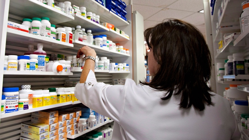 A pharmacist in Quebec verifies medication. The Quebec Treasury Board president, Sonia LeBel, is looking at expanding pharmacists' powers. (Jacques Boissinot, The Canadian Press)