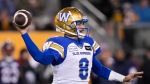 Winnipeg Blue Bombers quarterback Zach Collaros (8) throws the ball against the Montreal Alouettes during the first half of football action at the 110th CFL Grey Cup in Hamilton, Ont., on Sunday, November 19, 2023. (Nathan Denette/The Canadian Press)
