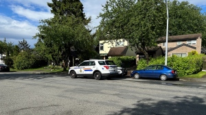 A police vehicle is pictured at the scene of a shooting in Surrey on Monday, June 3. 