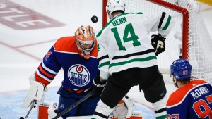 Edmonton Oilers goalie Stuart Skinner (74) deflects a shot by Dallas Stars forward Jamie Benn (14) during the second period of Game 6 of the Western Conference finals of the NHL hockey Stanley Cup playoffs in Edmonton on June 2, 2024. (Jeff McIntosh / The Canadian Press) 