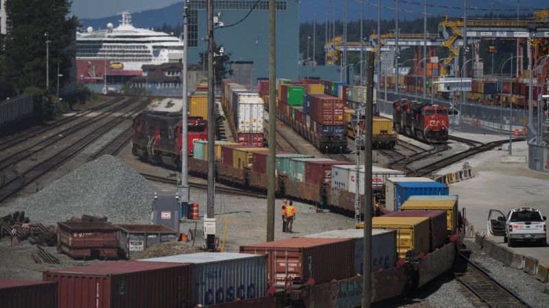 A CN Rail train moves cargo containers at the Centerm Container Terminal at port in Vancouver. (Darryl Dyck/The Canadian Press)