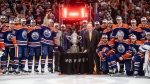 Edmonton Oilers stand with the Campbell Conference Bowl after beating the Dallas Stars in game 6 of the Western Conference finals of the NHL Stanley Cup playoffs in Edmonton on Sunday June 2, 2024. THE CANADIAN PRESS/Jason Franson