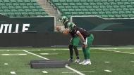 Trevor Harris and Shea Patterson practice with the Riders on June 3 at Mosaic Stadium. (BritDort/CTVNews) 