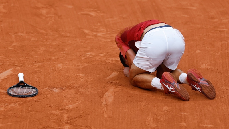 Serbia's Novak Djokovic slipped and fell during his fourth round match of the French Open tennis tournament against Argentina's Francisco Cerundolo at the Roland Garros stadium in Paris, Monday, June 3, 2024. (Jean-Francois Badias / AP Photo)