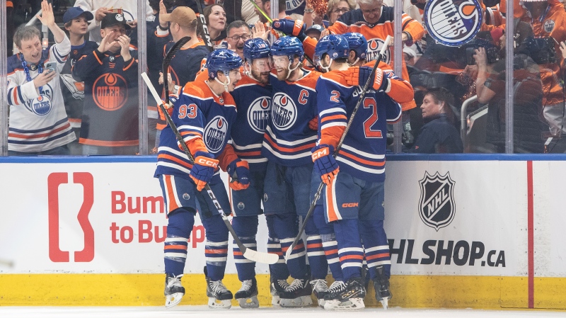 Edmonton Oilers players Ryan Nugent-Hopkins (93), Zach Hyman (18), Connor McDavid (97) and Evan Bouchard (2) celebrate a goal against the Dallas Stars during Game 6 of the NHL Western Conference Final on June 2, 2024, in Edmonton. (Jason Franson/The Canadian Press)
