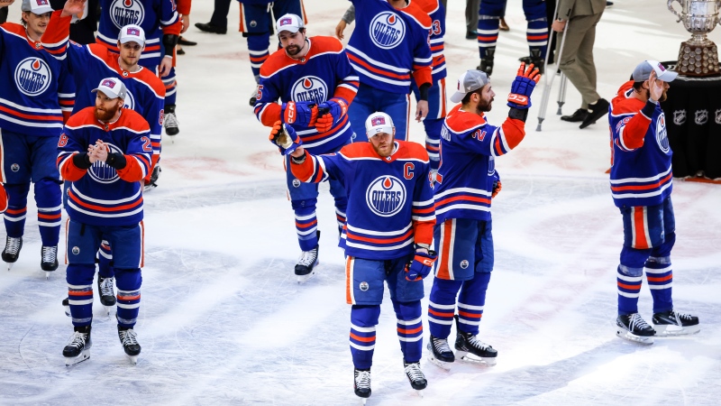 Edmonton Oilers star Connor McDavid (97) and his teammates wave to fans after defeating the Dallas Stars in Game 6 of NHL Western Conference Final on June 2, 2024, in Edmonton. (Jeff McIntosh/The Canadian Press)