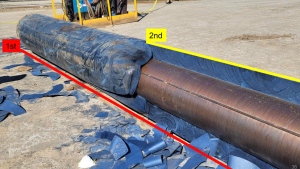 A photo of the calender roll Darrell Richards was working on at American Iron and Metal in Saint John on June 30, 2022, showing the first and second attempt at cutting away its denim covering.  (Courtesy: WorkSafe NB)
