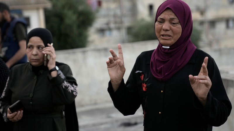 A distraught Palestinian woman reacts at the site where Israeli forces killed her nephew, a militant who was killed along with a civilian in a raid in the Balata refugee camp in the West Bank city of Nablus, Monday, June 3, 2024. (AP Photo/Majdi Mohammed)