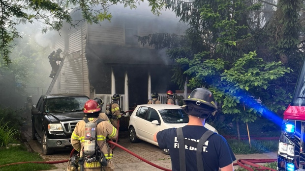 Fire crews work to put out a blaze at a home on Piccadilly Street in London, Ont. on June 4, 2024. (Source: London fire)
