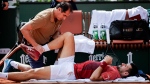 Djokovic receives treatment to his knee during the victory against Cerúndolo. (Antonio Borga / Eurasia Sport Images / Getty Images via CNN Newsource)