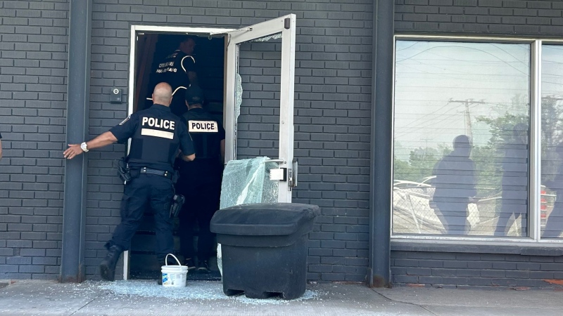 Police search a building on Montreal's West Island on Tuesday, June 4, 2024, in connection with an investigation into an alleged grandparent scam. (Source: Sûreté du Québec)