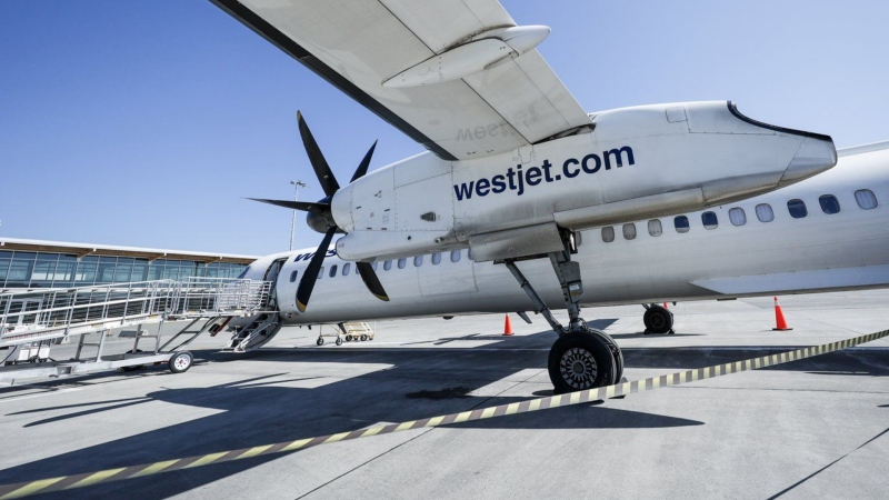 A WestJet Encore Bombardier Q400 twin-engine turboprop aircraft is prepared for a flight in Kamloops, B.C. THE CANADIAN PRESS/Jeff McIntosh