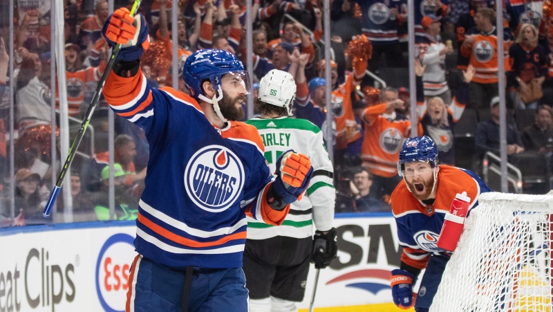 Edmonton Oilers forward Adam Henrique, left, celebrates a goal against the Dallas Stars during NHL playoff action on May 27, 2024, in Edmonton. (Jason Franson/The Canadian Press)
