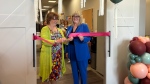 Barbara Byers and Catherine Curtis cut the ribbon to open the new Dress for Success Regina location. (Hallee Mandryk / CTV News) 