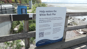 A digital terminal solicits donations to help seismically upgrade the White Rock pier. 