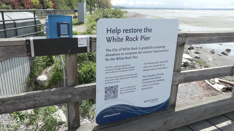 A digital terminal solicits donations to help seismically upgrade the White Rock pier. 