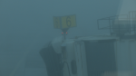 An airport gate is seen through thick fog in St. John's, N.L.