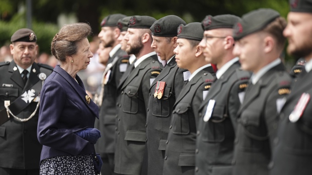 Princess Anne inspects the troops as she arrives to unveil a statue of a Second World War Canadian Royal Regina Rifleman during a reception with members of the regiment to mark the 80th anniversary of D-Day, at Place des Canadiens in Bretteville-l'Orgueilleuse, Normandy, France, Wednesday June 5, 2024. (Aaron Chown/Pool via AP)