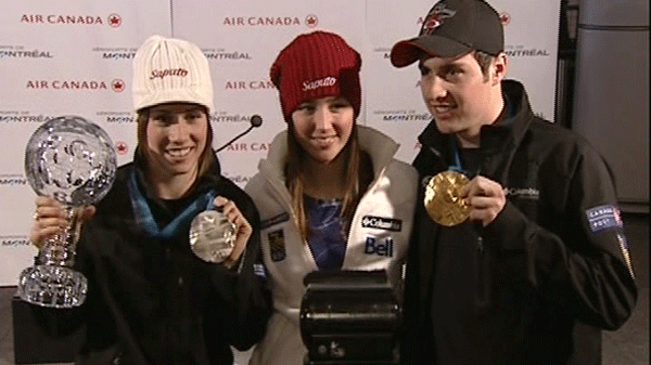 Women's silver medalist Jennifer Heil and men's moguls gold medalist Alexandre Bilodeau landed at Trudeau airport and to a heroes' welcome.