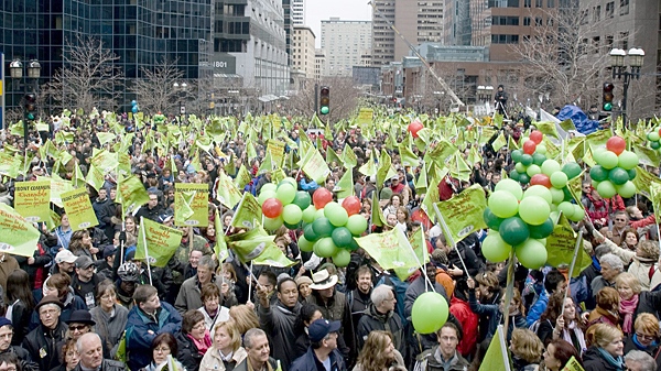 Demonstrators for public-sector workers gather outside the offices of Quebec Premier Jean Charest on McGill College Avenue in Montreal for a protest over lagging contract talks, Saturday, March 20, 2010. (Graham Hughes / THE CANADIAN PRESS)