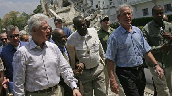 Haiti's President Rene Preval, second from left, former President George W. Bush, second from right, and former President and U.N. special envoy for Haiti Bill Clinton, left, arrive at the earthquake damaged Presidential Palace in Port-au-Prince, Monday, March. 22, 2010. (AP / Jorge Saenz)