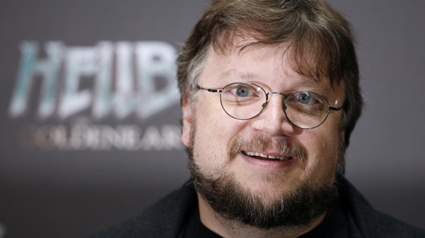 In this Aug. 19, 2008 file photo, Mexican director Guillermo del Toro poses for the media during a photo call to promote the movie "Hellboy 2-The Golden Army" in Berlin. (AP Photo/Miguel Villagran, file)