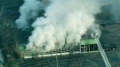 Heavy smoke can be seen pouring out of the Active Green and Ross shop on Dundas Street West in Mississauga on March 24, 2010.
