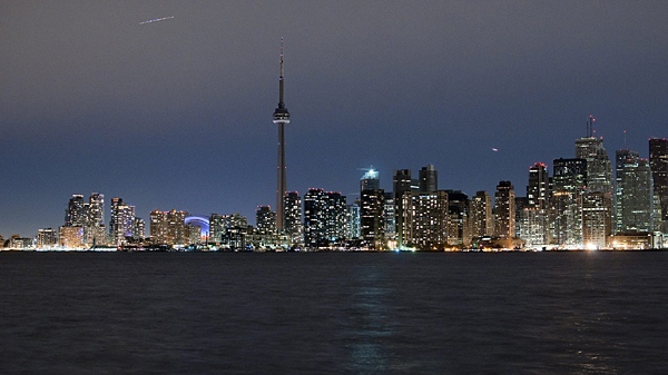 The darkened Toronto skyline is seen from Toronto Island at 8:30pm during the official start of Earth Hour on Saturday March 27, 2010. (Cole Burston / THE CANADIAN PRESS