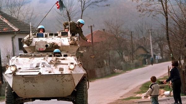 Canadian peacekeepers are seen on patrol in Bosnia, in March 1994. (Tom Hanson / THE CANADIAN PRESS)