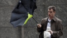 Wind upsets a person's umbrella during a storm in Philadelphia, Tuesday, March 30, 2010. (AP / Matt Rourke)