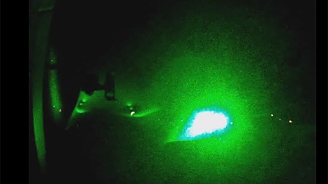 A screen capture from a Durham Regional Police video showing the simulated effects of a laser being beamed into the cockpit of an aircraft at night.