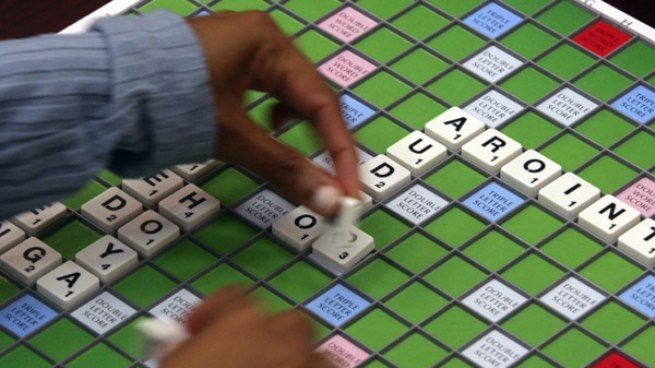 Dielle Saldanha, 19, places letters to spell a word while playing an opponent during a meeting of the Vancouver Scrabble Club in Vancouver, B.C., on Thursday August 14, 2008. (THE CANADIAN PRESS/Darryl Dyck)