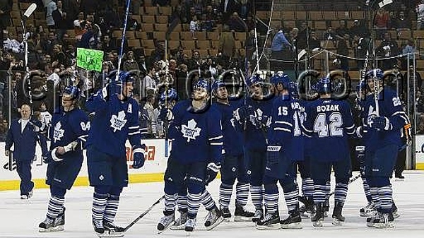 Toronto Maple Leafs players raise their sticks to honor the crowd after playing their last home game against the Philadelphia Flyers during third period NHL action on Tuesday, April 6, 2010 in Toronto. (Nathan Denette/THE CANADIAN PRESS)