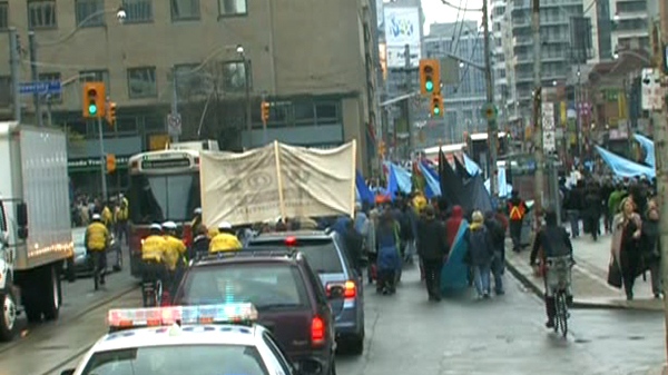 Members of the Grassy Narrows First Nation make their way to Queen's Park to protest, Wednesday, April 7, 2010.