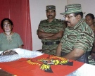 In this photo released by Liberation Tigers of Tamil Eelam, its leader Valupillai Prabhakaran, center, pays final respect to the remains of S.P .Tamilselvam, the public face of the rebels, at an undisclosed place in Killinochchi, Sri Lanka on Saturday, Nov. 3, 2007. (AP Photo/Liberation Tigers of Tamil Eelam, HO)