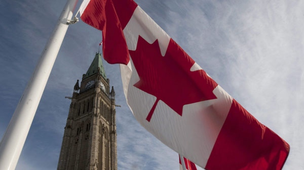 A Canadian flag flies under the Peace Tower Wednesday March 3, 2010. (THE CANADIAN PRESS/Adrian Wyld)