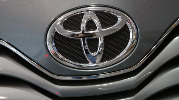 A Toyota logo is shown on the grille of a 2010 Toyota Camry in Miami. (AP / Alan Diaz)  