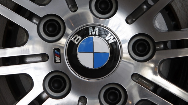 A BMW logo is photographed on a wheel of a BMW prior a press conference in Munich, southern Germany. (AP / atthias Schrader)